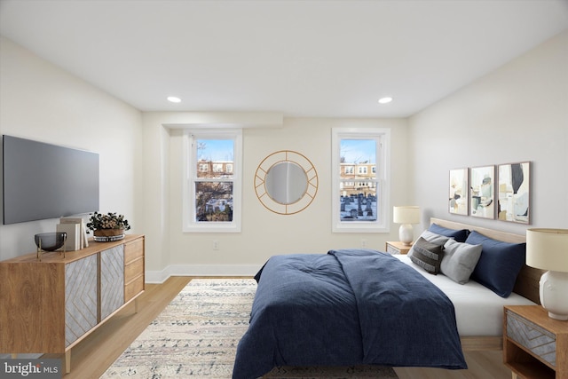 bedroom with light hardwood / wood-style floors