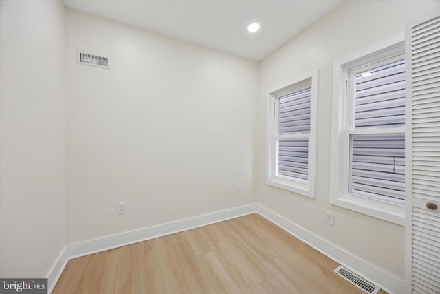 unfurnished room with light hardwood / wood-style floors