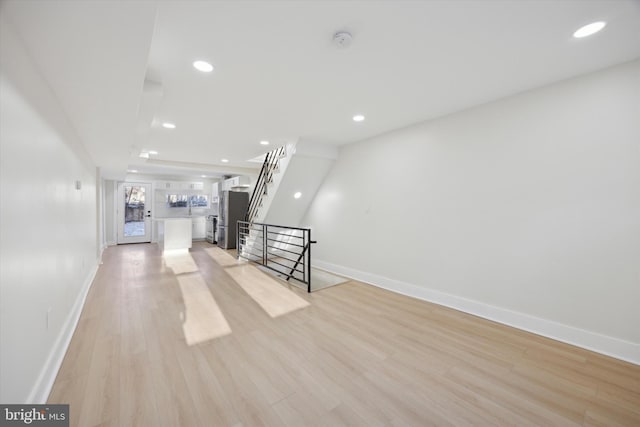 unfurnished living room with light hardwood / wood-style floors