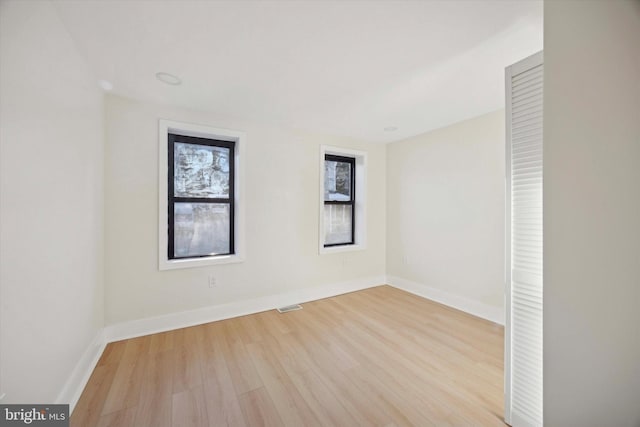 unfurnished room featuring light wood-type flooring