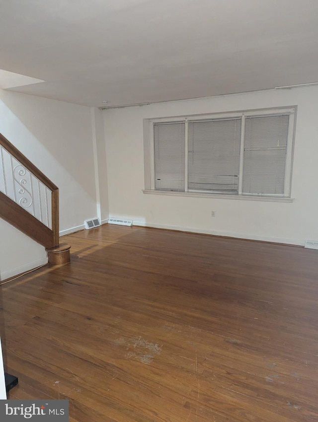 unfurnished room featuring hardwood / wood-style flooring