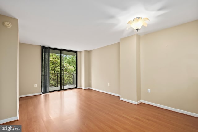 spare room with light wood-type flooring