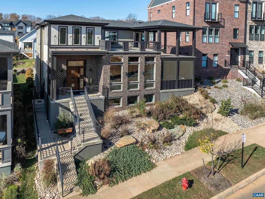 rear view of house featuring a balcony