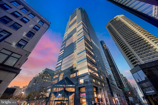 view of outdoor building at dusk