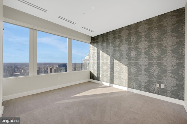 50 S 16th St Unit 5102, Philadelphia, PA 19102 - carpeted empty room with baseboards and wallpapered walls