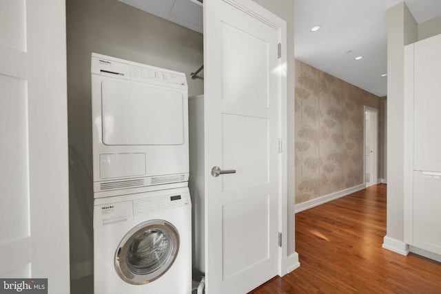 50 S 16th St Unit 5102, Philadelphia, PA 19102 - washroom with stacked washer and clothes dryer, baseboards, wood finished floors, wallpapered walls, and recessed lighting