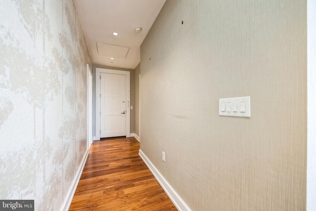 hallway with dark hardwood / wood-style flooring