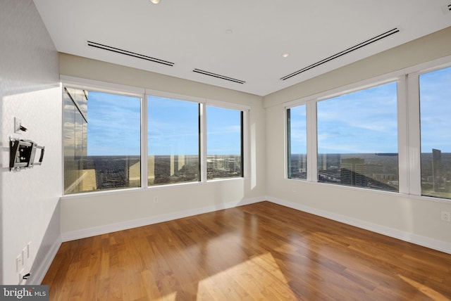 spare room featuring hardwood / wood-style floors