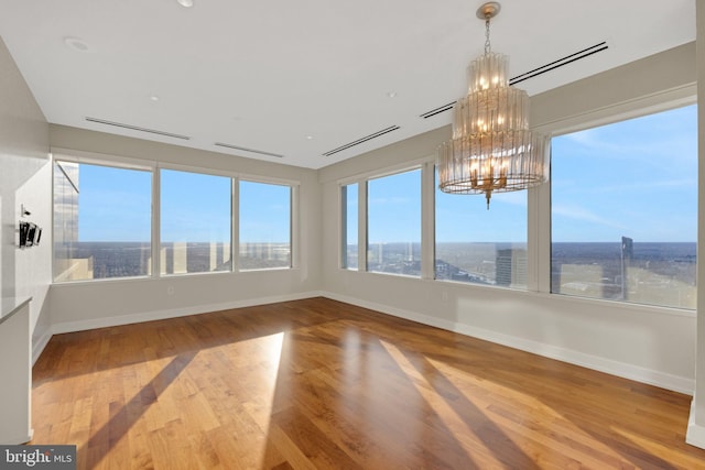 50 S 16th St Unit 5102, Philadelphia, PA 19102 - unfurnished sunroom with a chandelier, wood finished floors, and baseboards