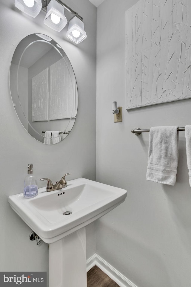 bathroom featuring hardwood / wood-style flooring and sink