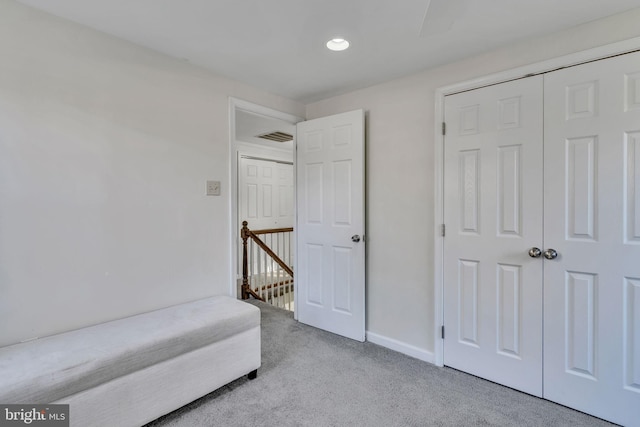 sitting room featuring light carpet