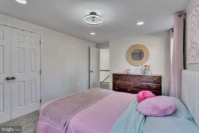 carpeted bedroom featuring a closet