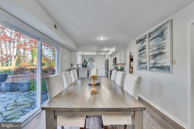 dining room with hardwood / wood-style floors