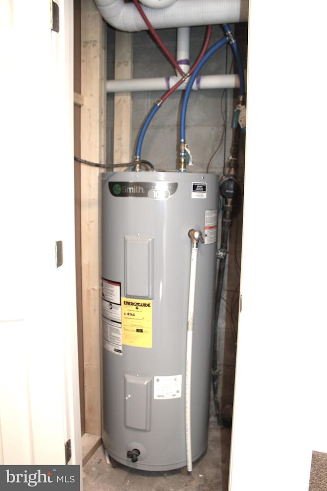 utility room featuring water heater