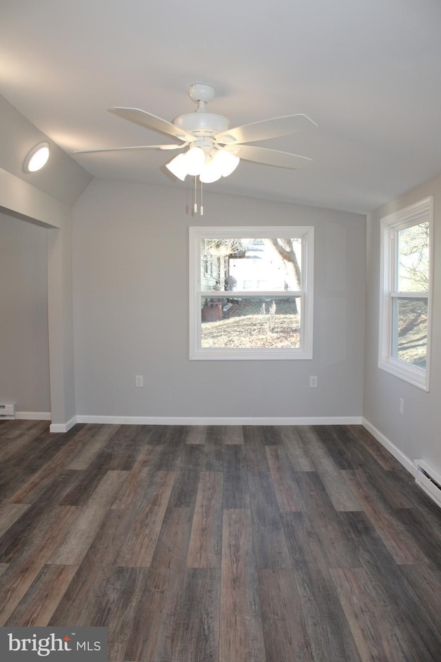 empty room featuring ceiling fan, dark hardwood / wood-style flooring, and lofted ceiling