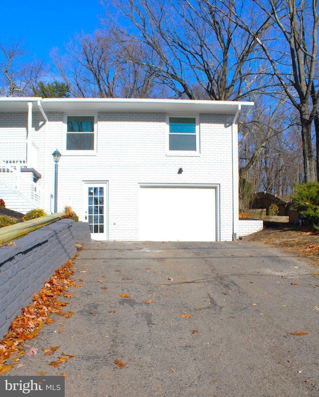 view of side of property with a garage