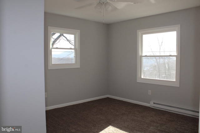 unfurnished room with dark colored carpet, ceiling fan, and baseboard heating