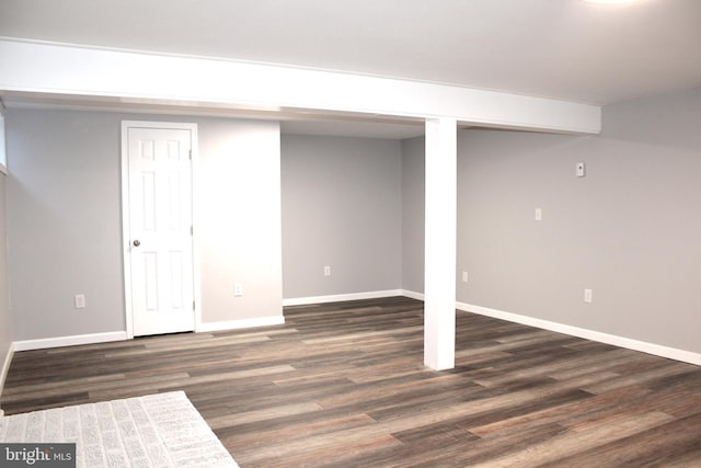 basement featuring dark hardwood / wood-style floors