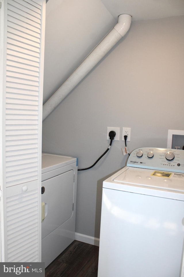 laundry room featuring dark hardwood / wood-style floors and washing machine and clothes dryer