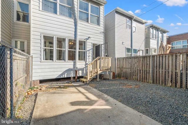 rear view of property featuring a patio area