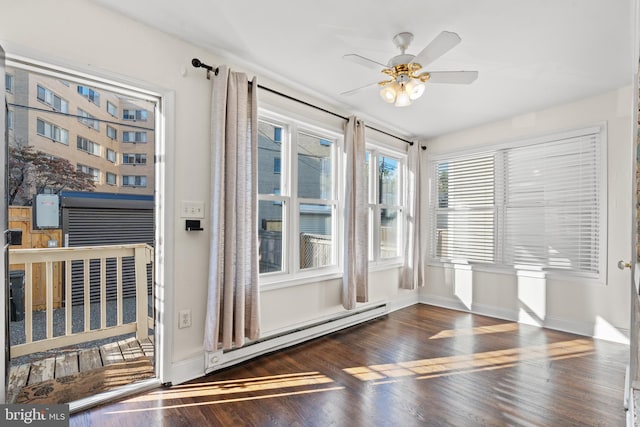 doorway to outside with dark hardwood / wood-style floors, ceiling fan, and baseboard heating