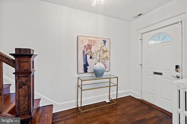 foyer entrance with dark hardwood / wood-style flooring