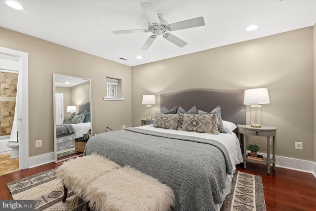 bedroom featuring ensuite bath, ceiling fan, and dark wood-type flooring