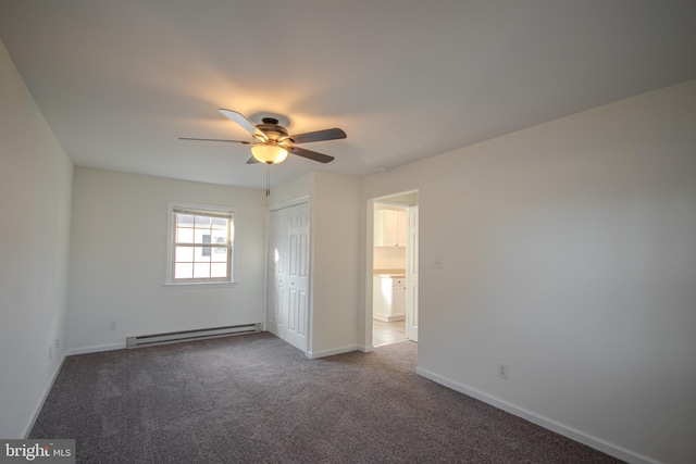 unfurnished bedroom with carpet flooring, a closet, ceiling fan, and a baseboard heating unit