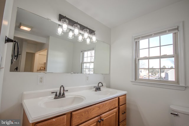 bathroom with vanity and toilet