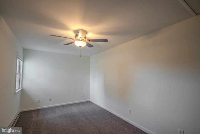 carpeted spare room featuring ceiling fan and baseboard heating