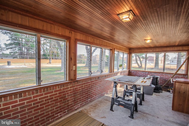 sunroom / solarium with plenty of natural light and wooden ceiling