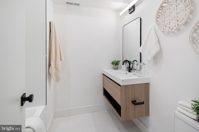 bathroom with tile patterned floors, vanity, and toilet