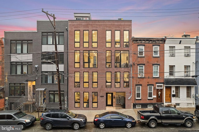 view of outdoor building at dusk