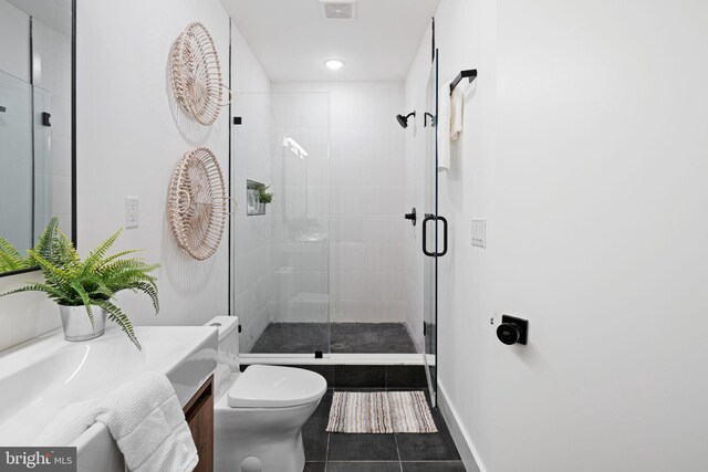 1936-38 E York St Unit 1, Philadelphia, PA 19125 - bathroom with vanity, tile patterned floors, a shower stall, toilet, and baseboards