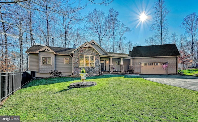 view of front facade with a garage and a front yard