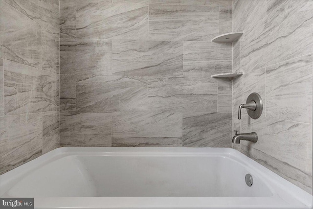 bathroom featuring a tub to relax in