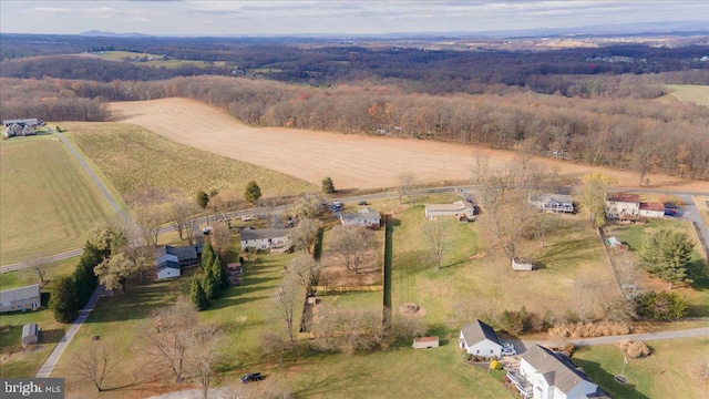 birds eye view of property with a rural view