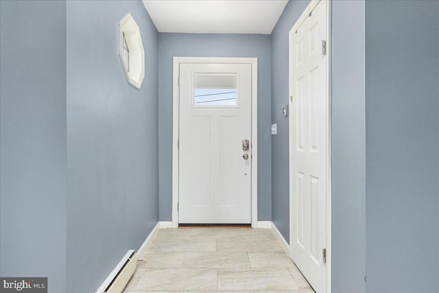 doorway to outside featuring a baseboard heating unit