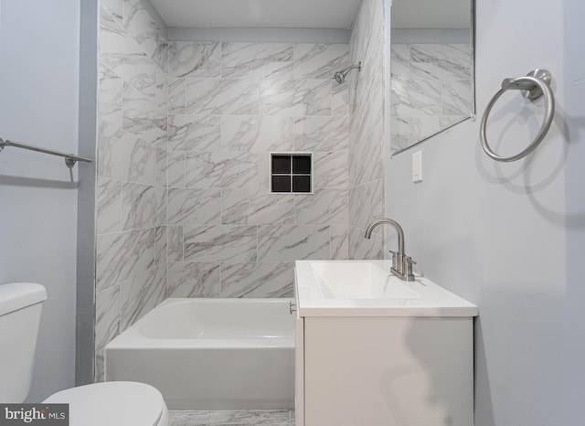 full bathroom with vanity, toilet, and tiled shower / bath combo