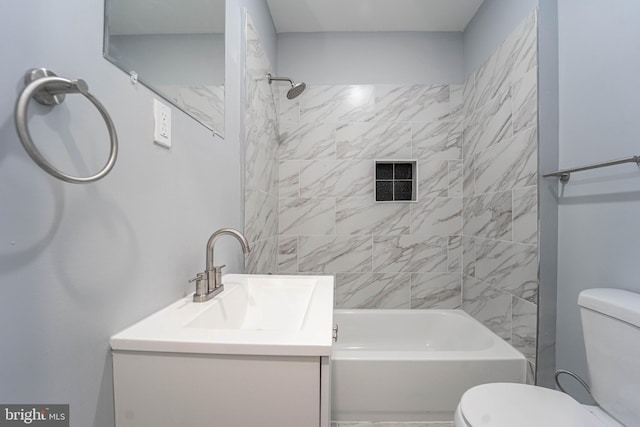 full bathroom featuring vanity, toilet, and tiled shower / bath