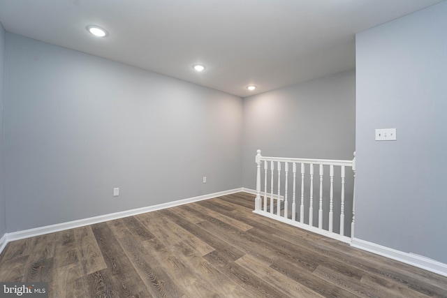 spare room with dark hardwood / wood-style floors