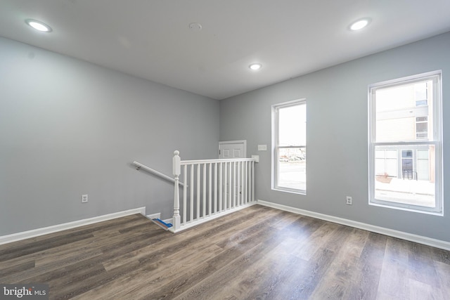 spare room featuring dark hardwood / wood-style floors