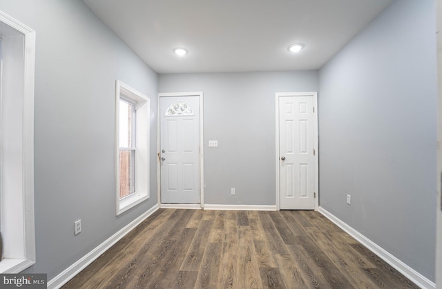 spare room featuring dark hardwood / wood-style flooring