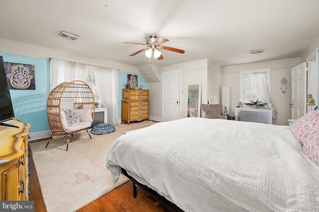 bedroom with wood-type flooring and ceiling fan