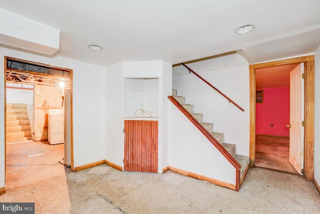 basement with washer / clothes dryer and carpet floors