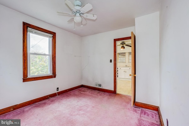 carpeted empty room with ceiling fan