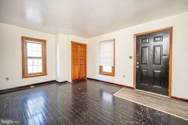 entrance foyer featuring dark hardwood / wood-style flooring