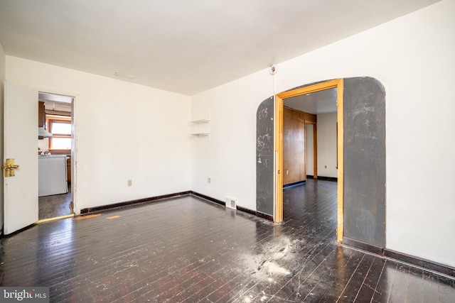 spare room featuring dark hardwood / wood-style floors