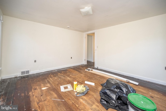 unfurnished room featuring dark hardwood / wood-style floors