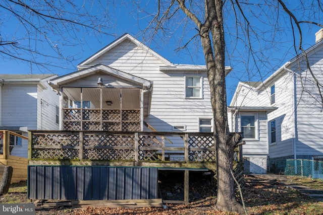 rear view of house with a balcony